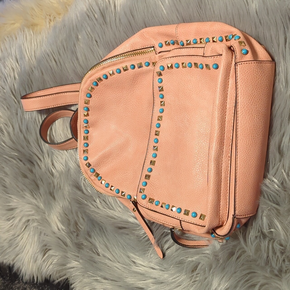 Coral color Urban Expressions backpack with embellishments